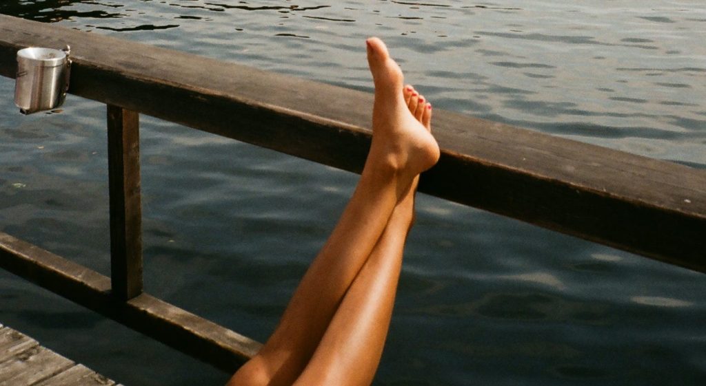 Photo by Darya Sannikova: https://www.pexels.com/photo/person-leaning-feet-on-wooden-railing-2938204/